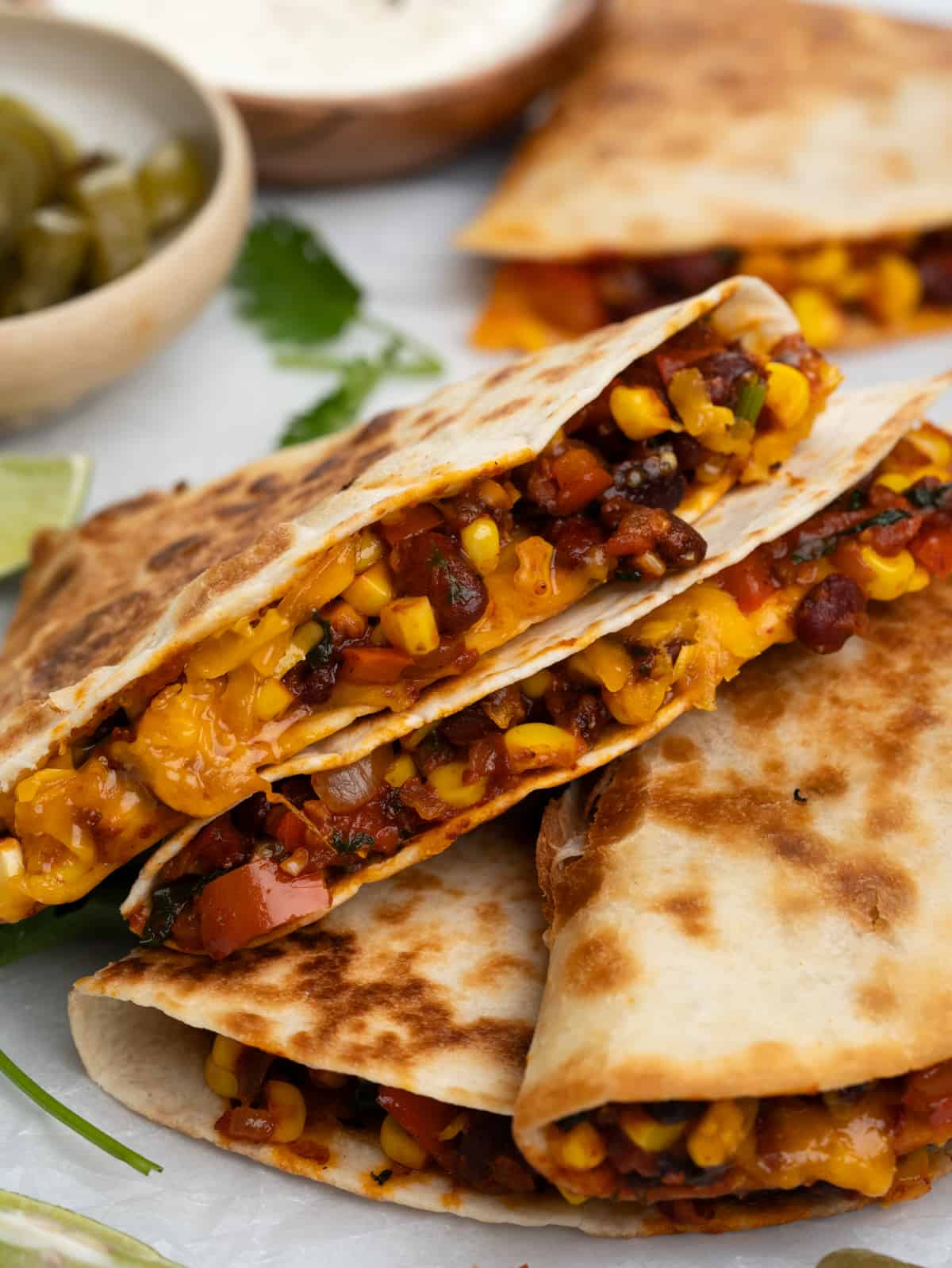 cheesy vegetable and bean quesedilla served with sour cream 