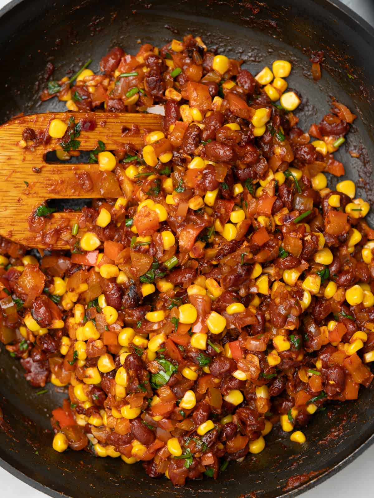 Bean, corn kernel, onion and peppers cooked with taco seasoning for quesadilla filling. 