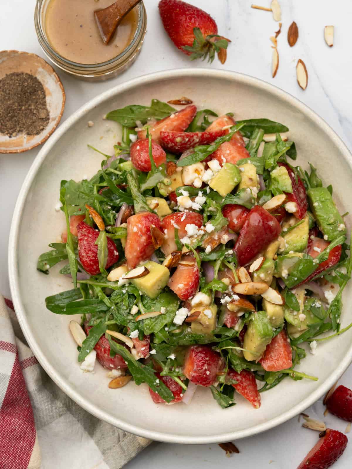 Strawberry salad with avocado, argula, red onion, feta and toasted almonds.