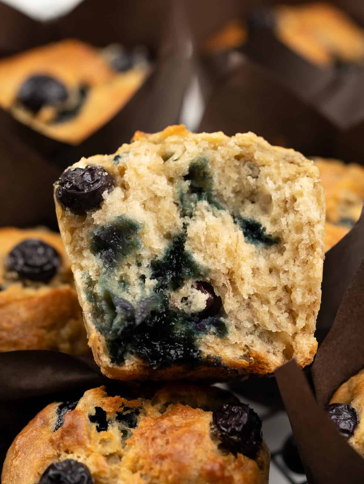 Cross section of blueberry banana muffins showing soft crumb.