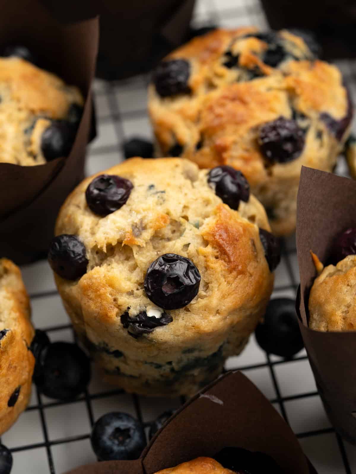 These blueberry banana muffins are soft and moist. Banana gives a natural sweetness to the tender crumbs and tiny blueberries bake into a jammy consistency. Tall bakery-style muffins with golden top will only take 30 minutes to make. 
