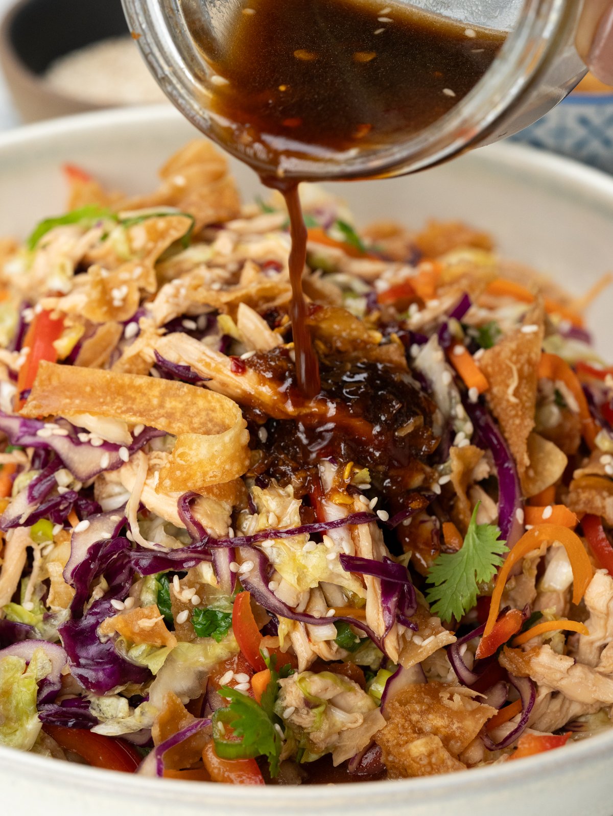 Drizzle Sesame dressing on tossed Chinese Chicken Salad. 