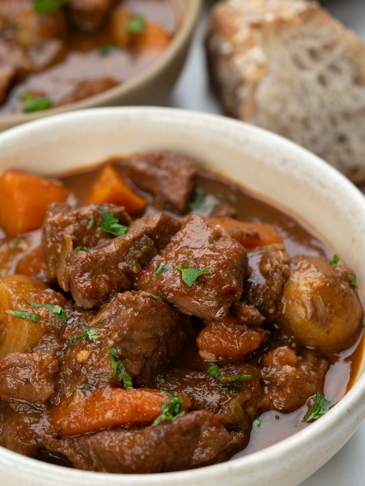 lamb stew with tender, fall-apart lamb chunks, potatoes and carrot has a rustic flavourful thick broth