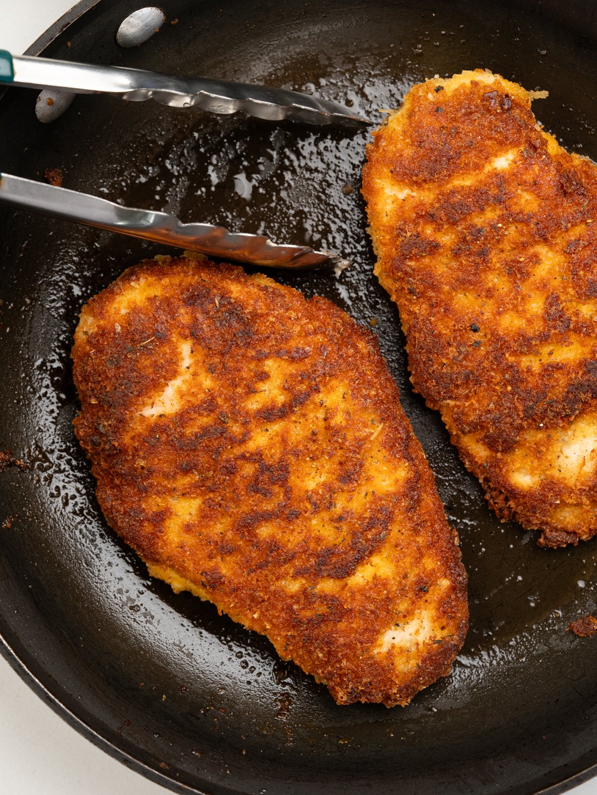 Chicken breast coated with a seasoned parmesan breading and pan fried until crispy. 