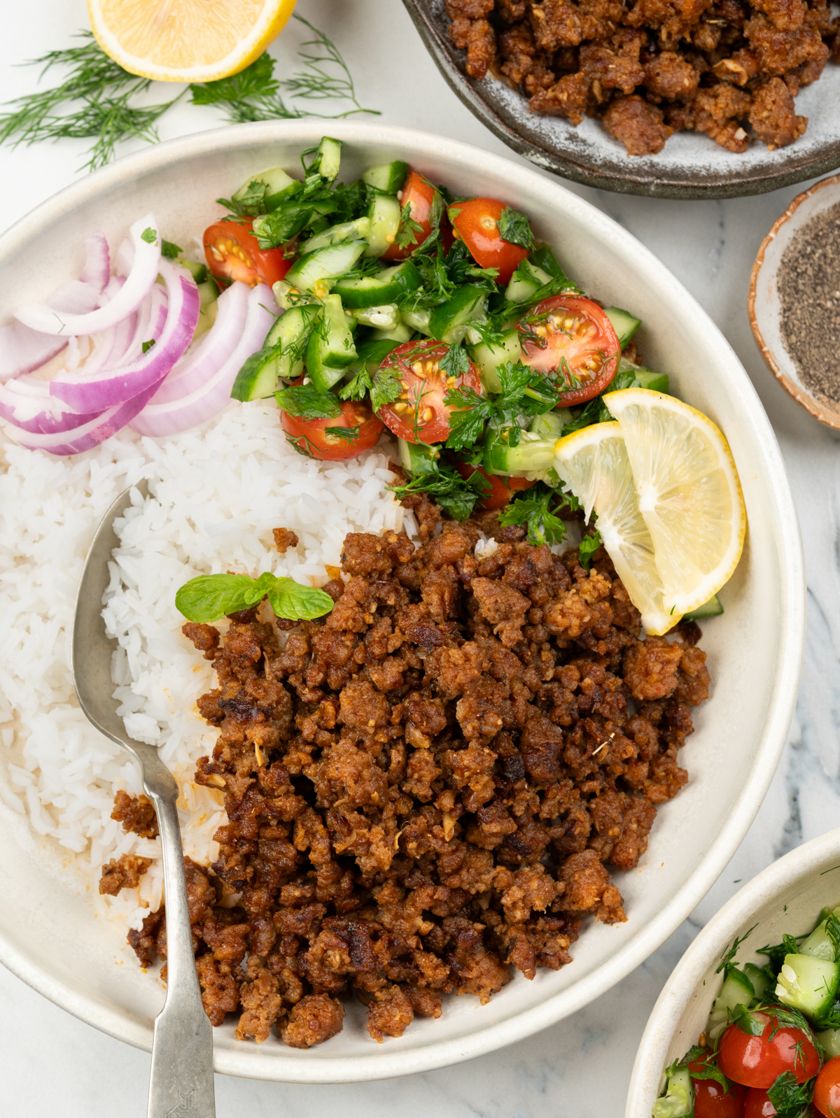 Ground lamb cooked with coriander, cumin, cinnamon and cayenne pepper until brown.  serve with rice and fresh green salad. 