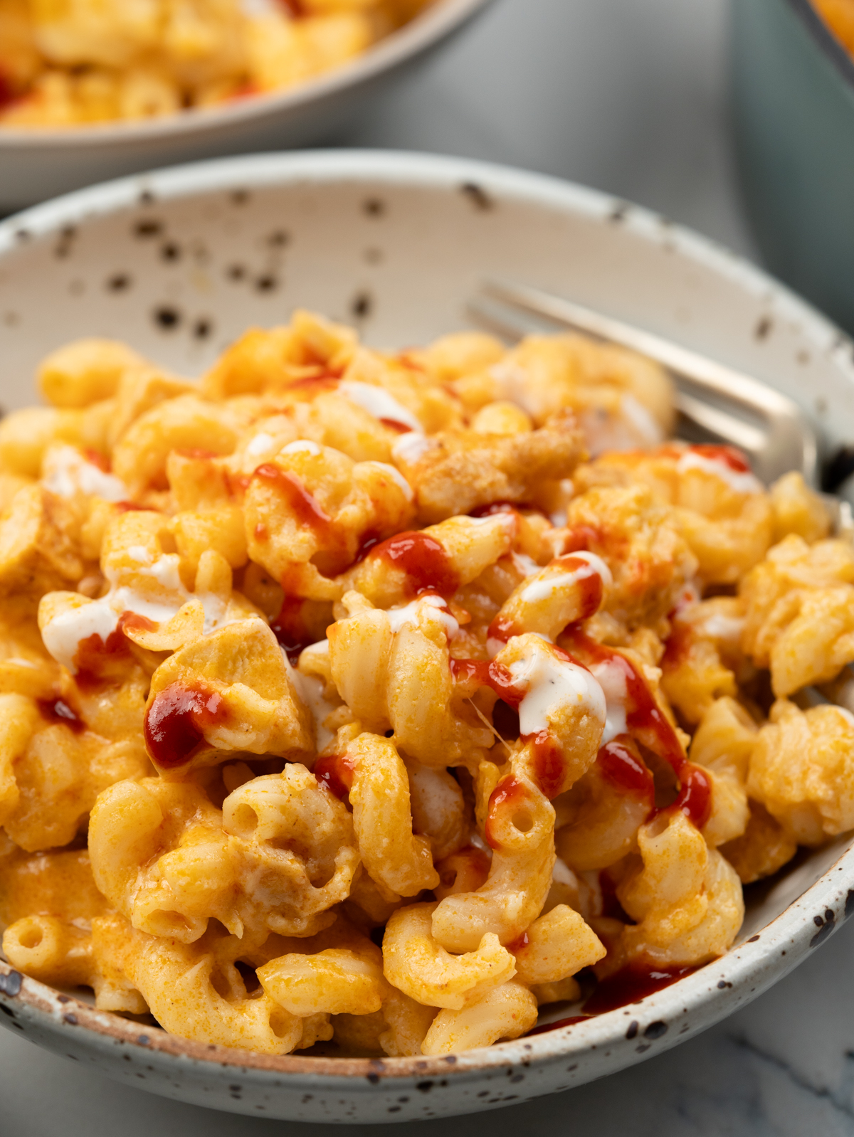 Mac and cheese uplifted with red hot buffalo sauce and a quick ranch dressing. 