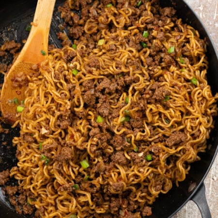 Asian Ramen noodle stir fry with ground beef. Topped with jammy egg and chilli crisp.