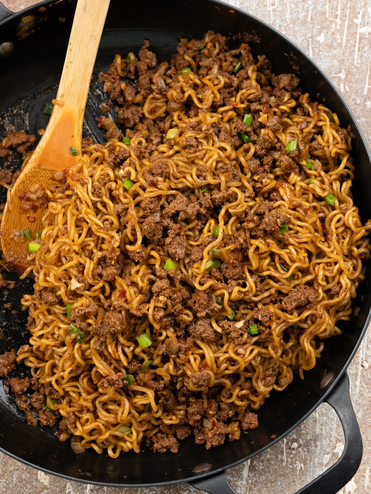 Ramen noodles stir fry in a savoury Asian sauce and caramelised ground beef