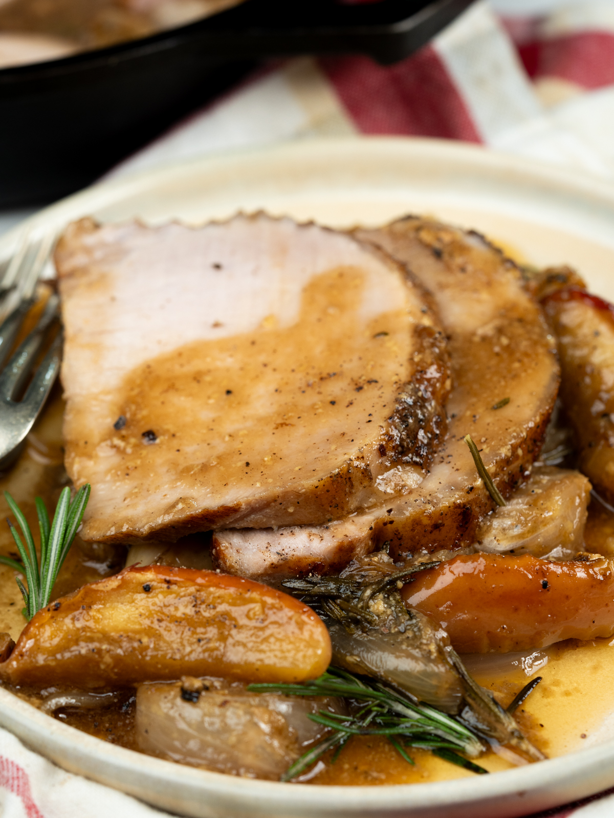 Baked pork loin slices coated with luscious apple sauce.