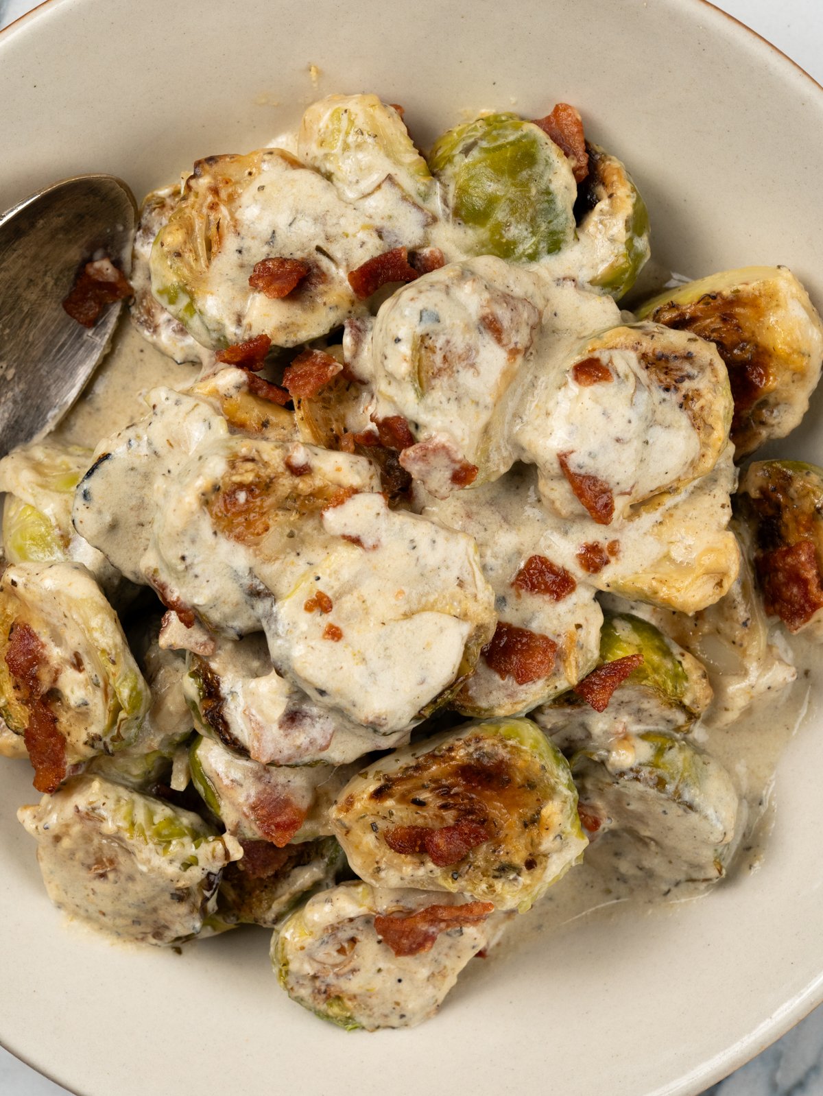 Brussels sprout in a creamy parmesan mix and crispy bacon