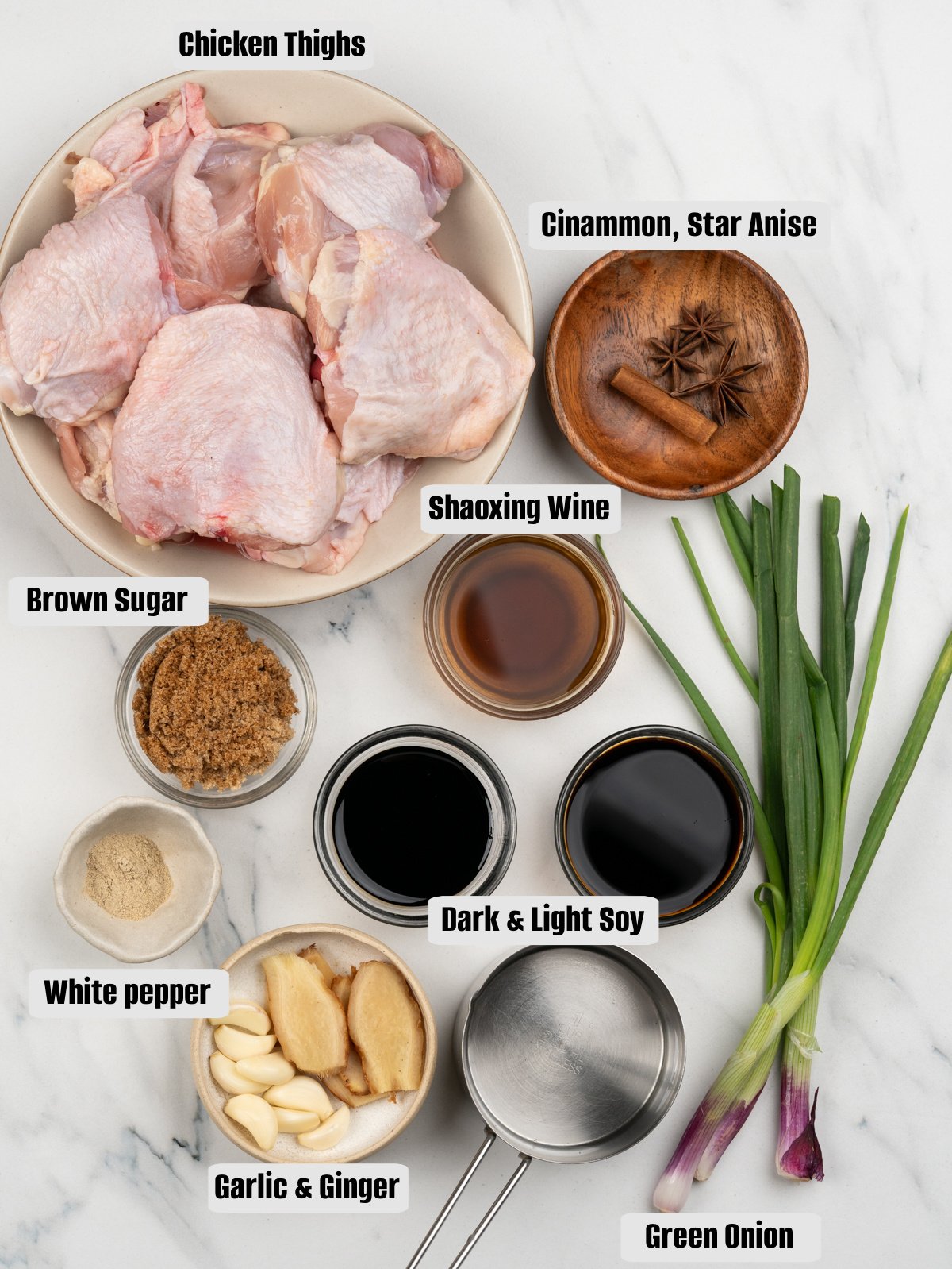 Ingredients for Soy sauce chicken - Chicken thighs, dark and light soy, Shaoxing wine, brown sugar, cinnamon and star anise, ginger, garlic, green onion and seasonings.