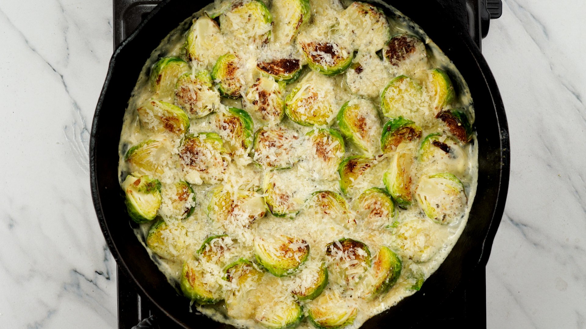 Cook brown brussels sprout with bacon and creamy parmesan mixture. 