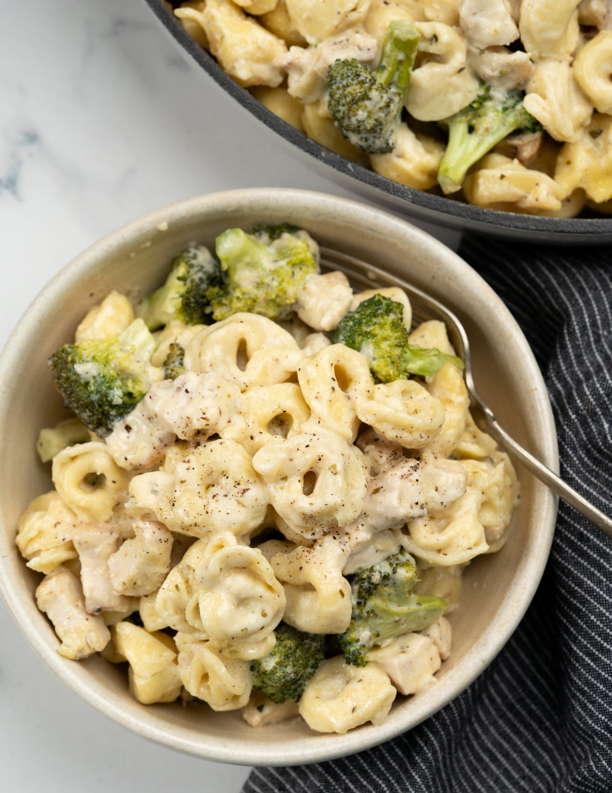 Baked chicken Tortellini served in a bowl.