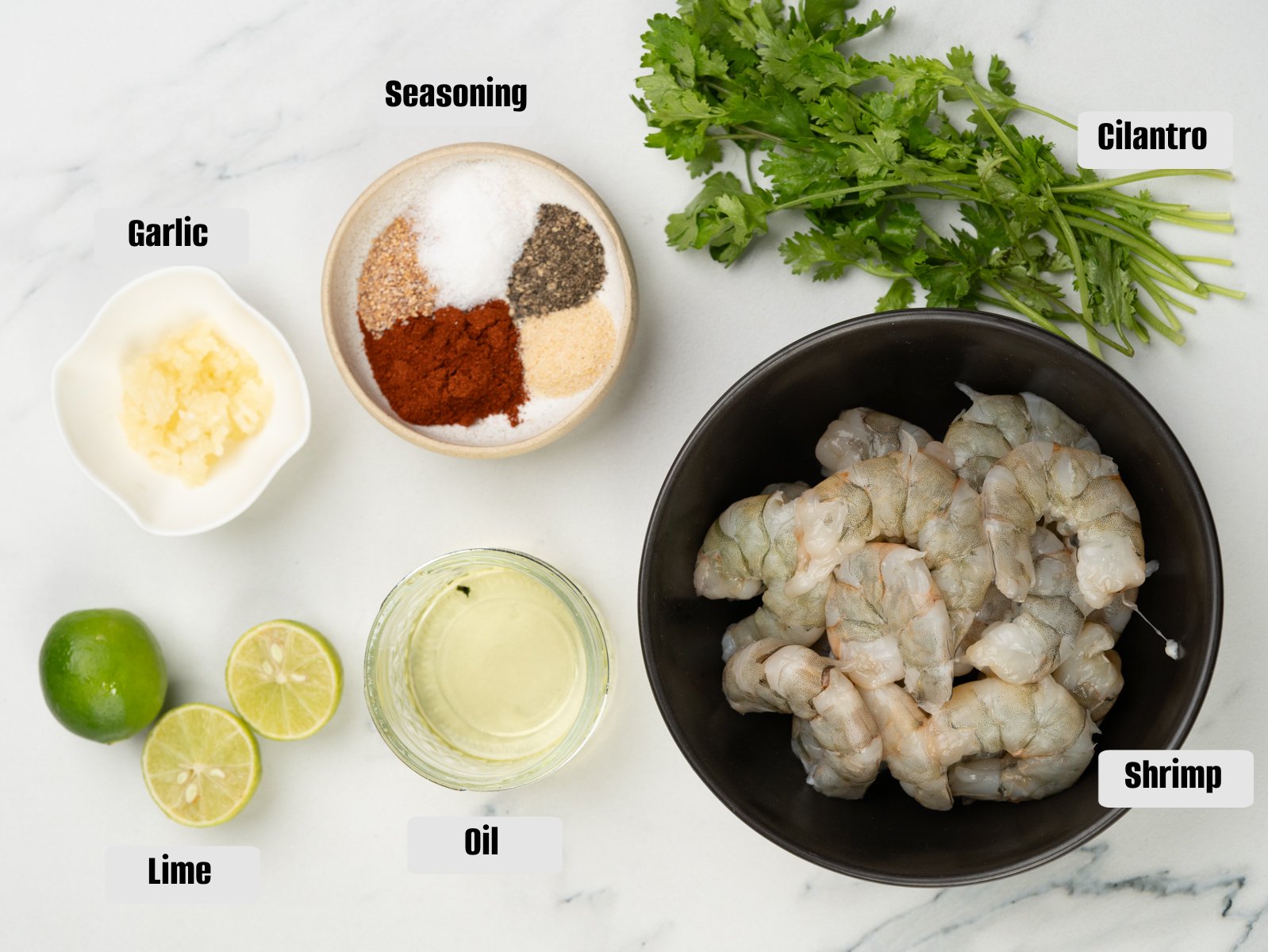 Ingredients for marinating the shrimp - Shrimp, seasonings, garlic, lime, oil and cilantro.