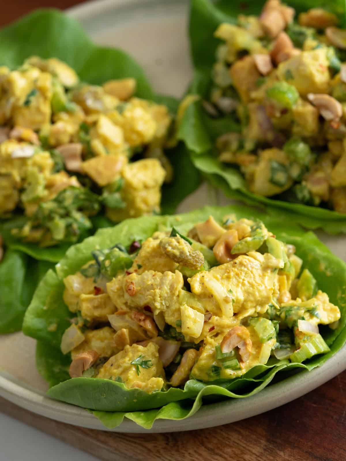 Creamy curried chicken salad served on lettuce wrap.