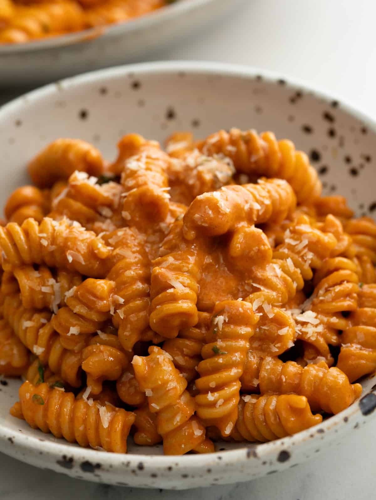 Fusili pasta tossed in a creamy parmesan gochujang sauce.