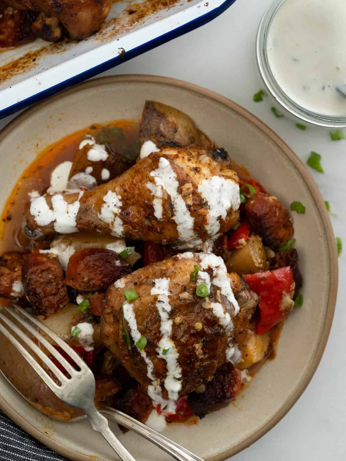 One pan baked chicken and chorizo drizzled with garlic yogurt sauce